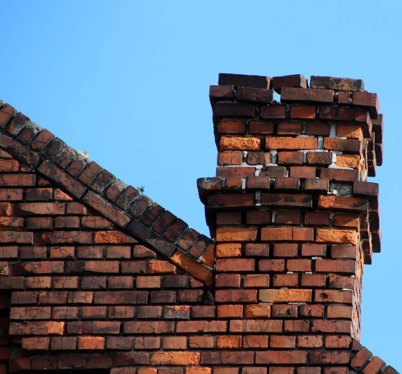 Damaged chimney on an Reading home showing cracks and missing mortar